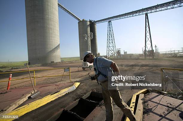 KFx Inc. Employee looks through the opening of a below ground coal crushing unit for the company's K-Fuel coal thermal upgrading plant June 13 in...