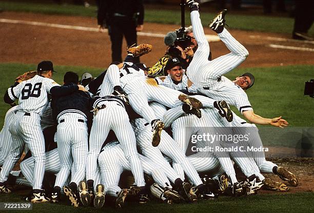 The New York Yankees celebrating after winning the 1996 World Series against the Atlanta Braves at Yankee Stadium on October 26, 1996 in the Bronx,...