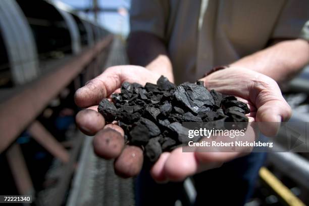 KFx company executive shows off a handful of the company's K-Fuel or "clean coal," an upgraded coal produced with nearby Powder River Basin coal and...