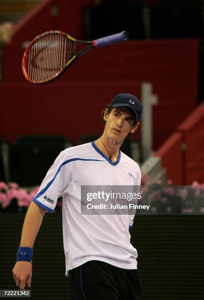 Andy Murray of Great Britain throws his racquet in frustration in his match against Novak Djokovic of Serbia and Montenegro in the third round during...