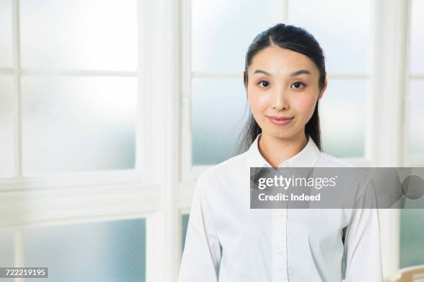 young woman waring white shirt - よそいきの服 ストックフォトと画像