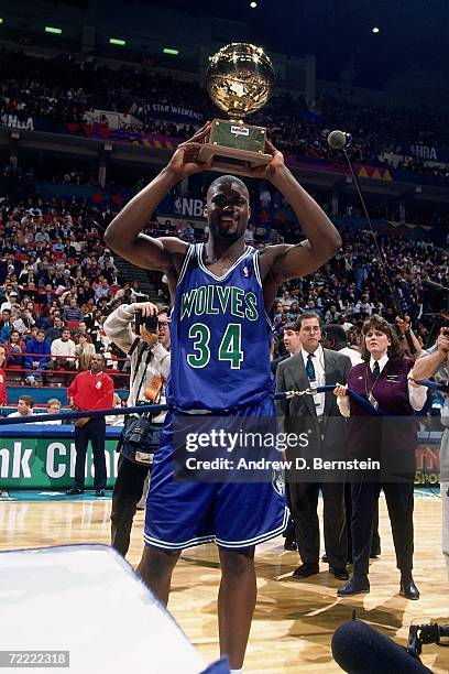 Isaiah "JR" Rider of the Minnesota Timberwolves holds the trophy after winning the 1994 Slam Dunk Contest on February 12, 1994 at the Target Center...