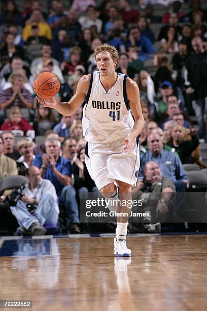 Dirk Nowitzki of the Dallas Mavericks pushes the ball up the court against the Milwaukee Bucks on October 19, 2006 at the American Airlines Center in...