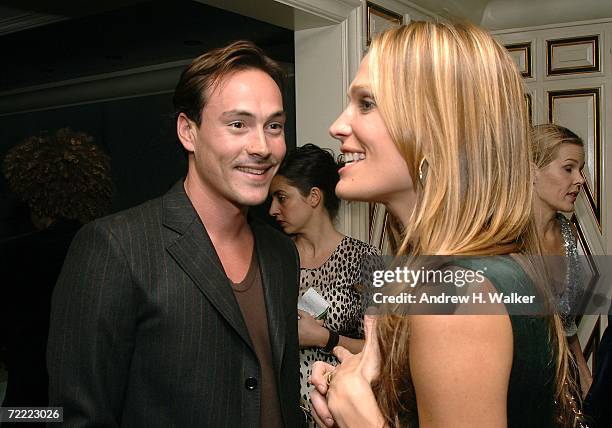 Actor Chris Klein speaks with model Molly Sims at a Moschino dinner at Bergdorf Goodman hosted by Alexis Bryan, Nina Garcia, Ginnifer Goodwin, and...