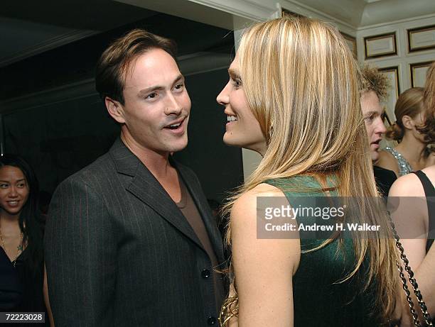 Actor Chris Klein speaks with model Molly Sims at a Moschino dinner at Bergdorf Goodman hosted by Alexis Bryan, Nina Garcia, Ginnifer Goodwin, and...