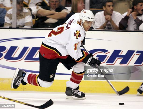 Jarome Iginla of the Calgary Flames takes the puck against the Boston Bruins during the home opener on October 19, 2006 at TD Banknorth Garden in...