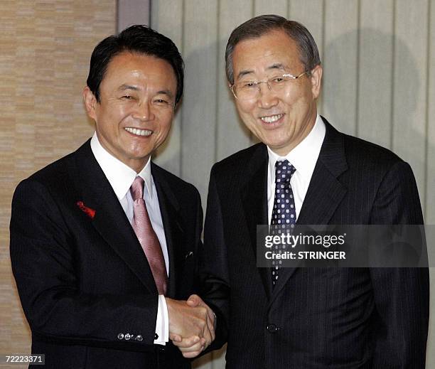 Republic Of Korea: South Korean Foreign Minister Ban Ki-moon shakes hands with his Japanese counterpart Taro Aso during their breakfast meeting in...