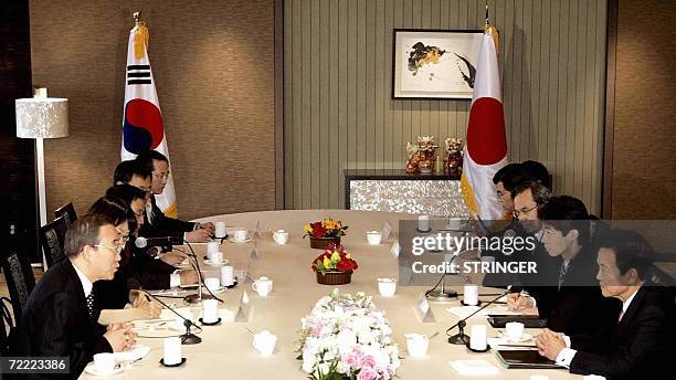 South Korean Foreign Minister Ban Ki-moon and his Japanese counterpart Taro Aso during their breakfast meeting in Seoul, 20 October 2006. Ban and Aso...