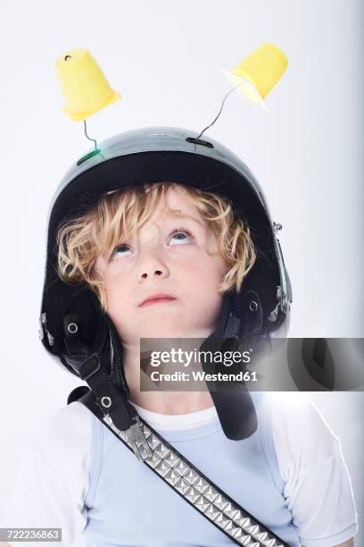 portrait of a boy dressed up as spaceman - astronaut helmet stock pictures, royalty-free photos & images