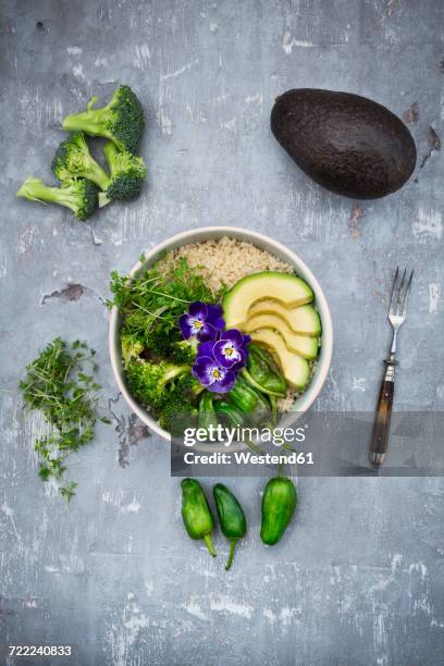 detox bowl of brokkoli, quinoa, avocado, pimientos de padron, cress and pansies - brokkoli stock pictures, royalty-free photos & images