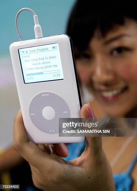 By PETER WUETHERICH - A hostess shows a model of the Apple iPod during a press conference in Hong Kong 21 July 2004. Five years ago, on 23 October...