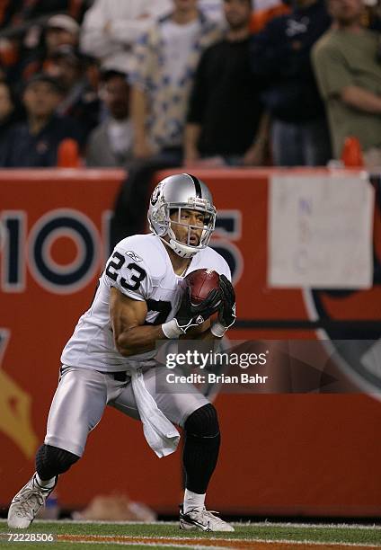 Kick returner Chris Carr of the Oakland Raiders catches a kick against the Denver Broncos on October 15, 2006 at Invesco Field at Mile High in...