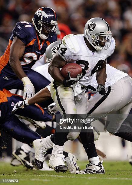 Running back LaMont Jordan of the Oakland Raiders carries the ball against the Denver Broncos on October 15, 2006 at Invesco Field at Mile High in...