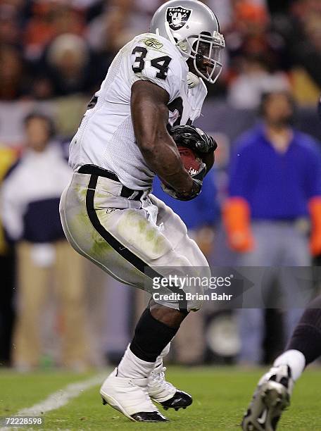 Running back LaMont Jordan of the Oakland Raiders carries the ball against the Denver Broncos on October 15, 2006 at Invesco Field at Mile High in...