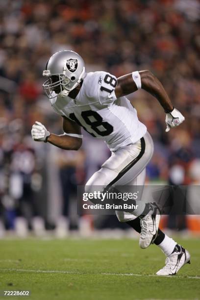 Wide receiver Randy Moss of the Oakland Raiders runs downfield against the Denver Broncos on October 15, 2006 at Invesco Field at Mile High in...