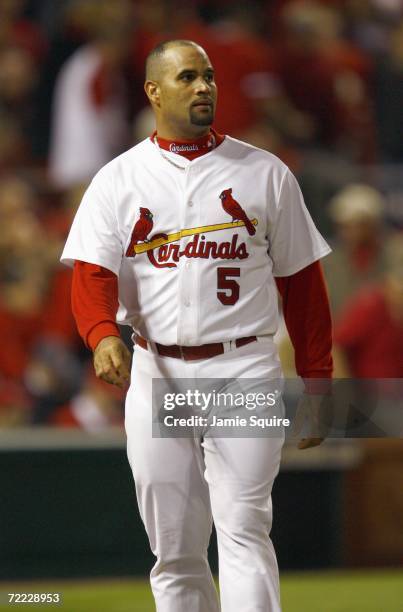 Albert Pujols of the St. Louis Cardinals walks on the field against the New York Mets in game three of the NLCS at Busch Stadium on October 14, 2006...