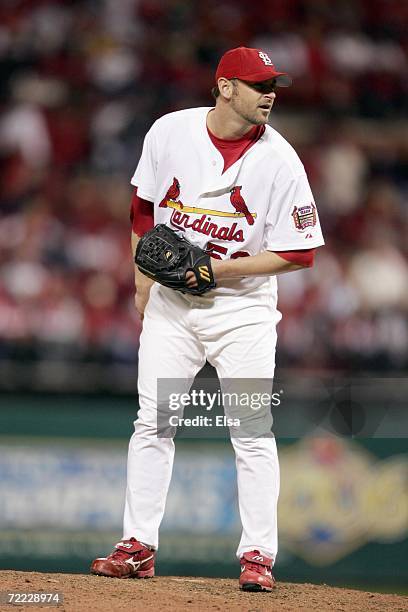 Josh Kinney of the St. Louis Cardinals lines up the pitch against the New York Mets in game three of the NLCS at Busch Stadium on October 14, 2006 in...