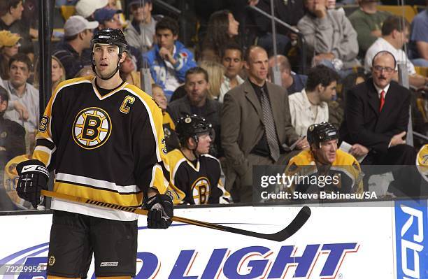 Zdeno Chara and new head coach Dave Lewis of the Boston Bruins wait for a faceoff against the Calgary Flames at the TD Banknorth Garden on October...