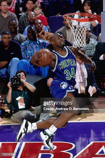 Isaiah Rider of the Minnesota Timberwolves attempts a dunk during the 1995 Slam Dunk Contest on February 11, 1995 at the America West Arena in...