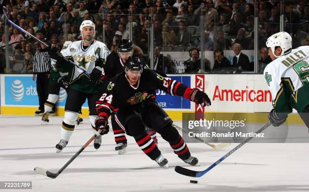 Right wing Martin Havlat of the Chicago Blackhawks puts pressure on Trevor Daley of the Dallas Stars at the American Airlines Center October 20, 2006...