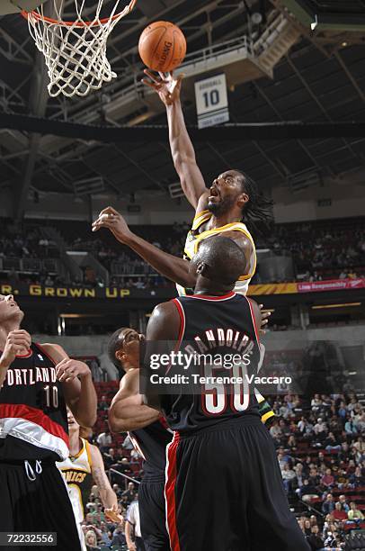 Chris Wilcox of the Seattle SuperSonics shoots against Zach Randolph of the Portland Trail Blazers on October 20, 2006 at the Key Arena in Seattle,...