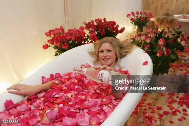 Julia Kardash sits in an evian bath before the Alexander Gapchuk Fashion Show as part of Russian Fashion Week Spring/Summer 2007 on October 21, 2006...