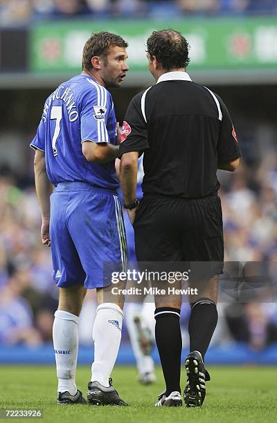 Andriy Shevchenko of Chelsea talks to referee Mark Clattenburg as he is booked for over-celebrating during the Barclays Premiership match between...