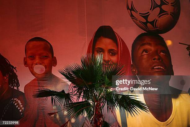 Palm tree stands near an advertising mural near Hollywood and Highland as many of the area?s palms fade into history because of a fatal fungus, old...