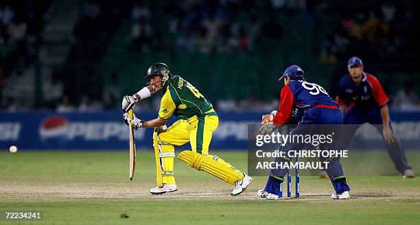 Australian cricketer Michael Hussey plays a stroke during an ICC Champions Trophy 2006 match against England at The Sawai Man Singh Stadium in...