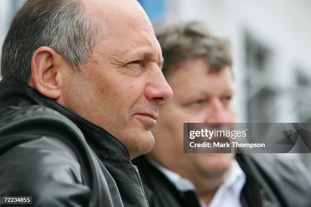 Team principal Ron Dennis of Mercedes McLaren and Mercedes Motorsport director Norbert Haug look on in the garage during the qualifying session of...
