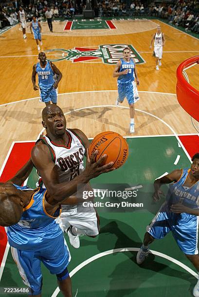 Ruben Patterson of the Milwaukee Bucks shoots a jump shot against Joe Smith of the Denver Nuggets October 21, 2006 at the Bradley Center in...