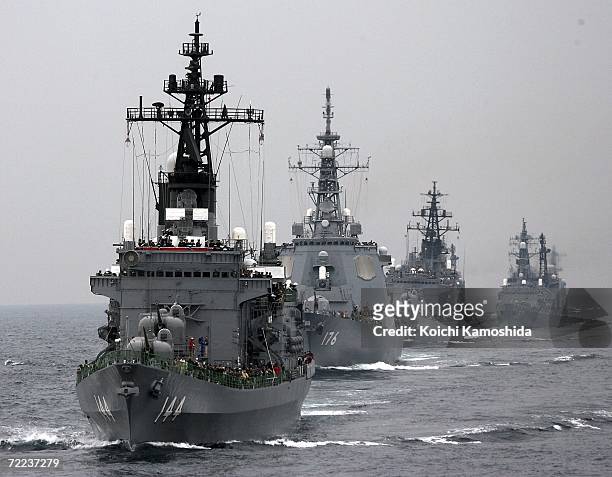 Ships of the Japanese Maritime Self-Defense Force sail in formation during a naval fleet review exercises on October 22, 2006 off Sagami Bay, Japan....
