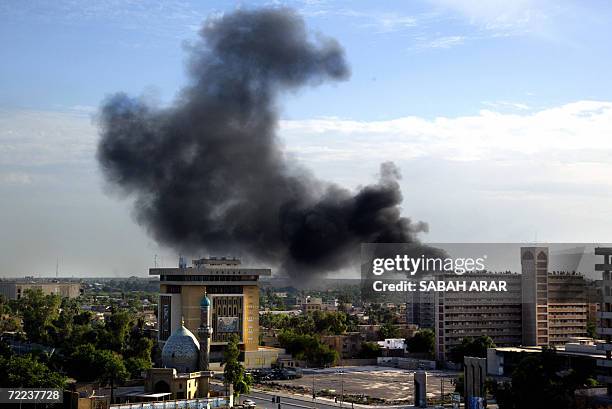 Black smoke rises from the heavily fortified Green Zone area in Baghdad 22 October 2006. A fire in Baghdad's heavily fortified Green Zone sparked...