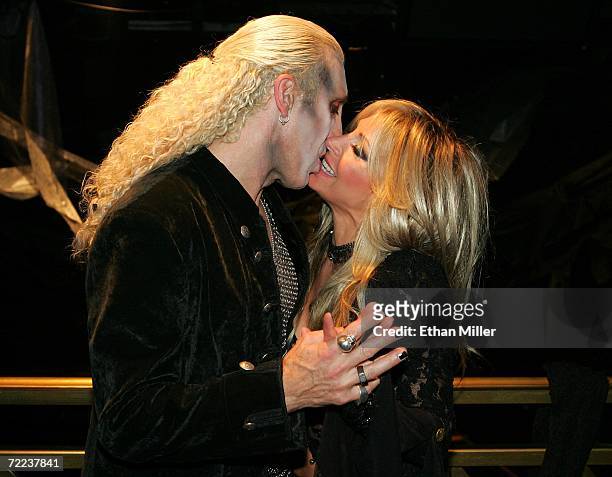 Twisted Sister singer Dee Snider kisses his wife Suzette backstage after their wedding vow renewal ceremony following a performance of Dee Snider's...