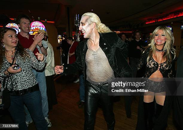 Twisted Sister singer Dee Snider and his wife Suzette are greeted by fans as they walk through the Hard Rock Hotel & Casino after their wedding vow...