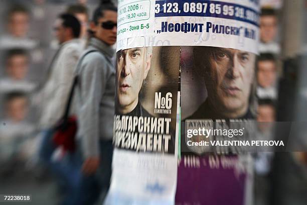 People walk by pre-election campaign posters of ultra-nationalist candidate Volen Siderov and incumbent president Georgy Parvanov, inSofia, 22...