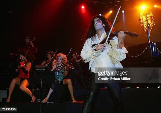 Violinists Asha Mevlana, Jen Spingola and Mark Wood, perform as part of Twisted Sister singer Dee Snider and his wife Suzette's wedding vow renewal...