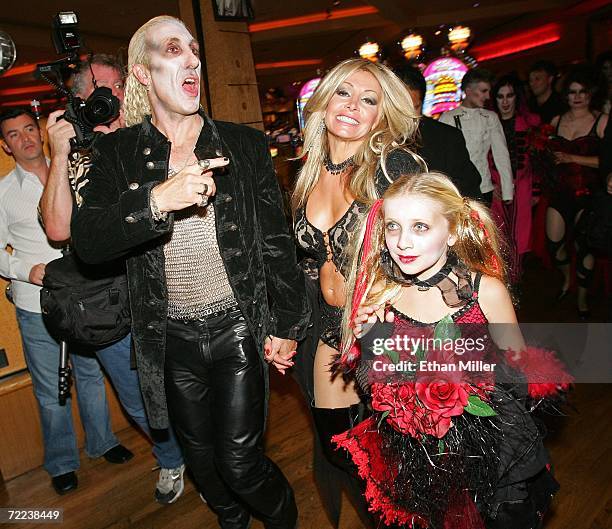 Twisted Sister singer Dee Snider, his wife Suzette and their daughter Cheyenne Snider walk through the Hard Rock Hotel & Casino after the couple's...