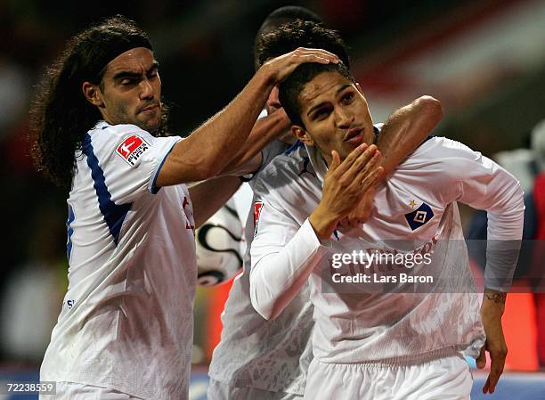 Paolo Guerrero of Hamburg celebrates scoring the second goal with team mate Juan Pablo Sorin during the Bundesliga match between Bayer Leverkusen and...