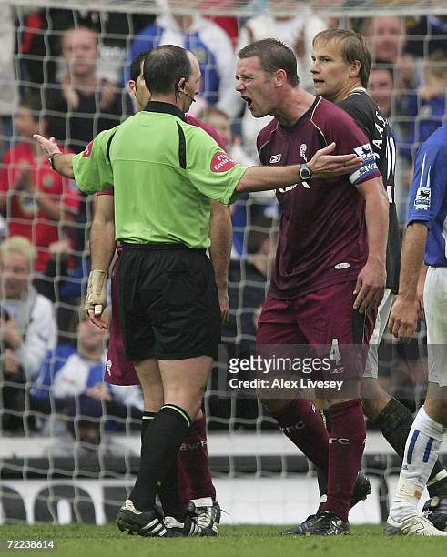 Kevin Nolan of Bolton Wanderers argues with referee, Mike Dean after he awards a second penalty to Blackburn Rovers during the Barclays Premiership...