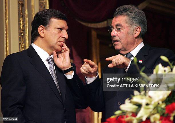 Austrian President Heinz Fischer chats with President of the European Commission Jose Manuel Barroso in the State Opera House of Budapest 22 October...
