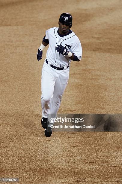 Craig Monroe of the Detroit Tigers rounds the bases on his solo home run in the bottom of the first inning against Jeff Weaver of the St. Louis...
