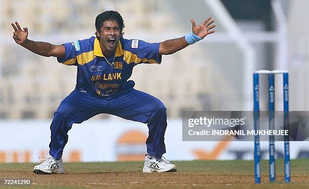 Sri Lankan cricketer Chaminda Vaas appeals against unseen New Zealand cricketer Lou Vincent during their ICC Champions Trophy 2006 match in Mumbai,...