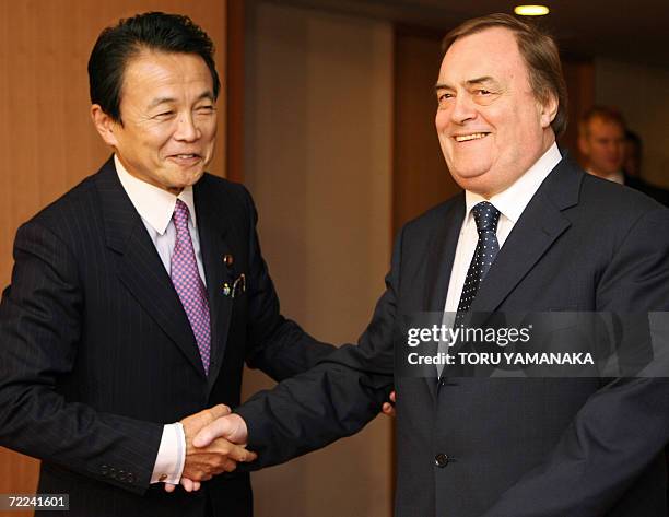 British Deputy Prime Minister John Prescott is welcomed by Japanese Foreign Minister Taro Aso prior to their talks at the Foreign Ministry in Tokyo,...