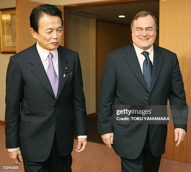British Deputy Prime Minister John Prescott chats with Japanese Foreign Minister Taro Aso prior to their talks at the Foreign Ministry in Tokyo, 23...