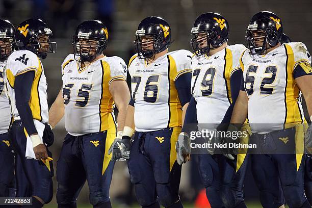 Offensive lineman Jeremy Sheffey, Dan Mozes, Greg Isdaner and Ryan Stanchek and quarterback Patrick White of the West Virginia University...