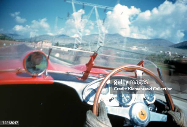 British racing driver Peter Collins competing for Ferrari in the Mille Miglia along the Adriatic coast, May 1957 the last year the race was run in...