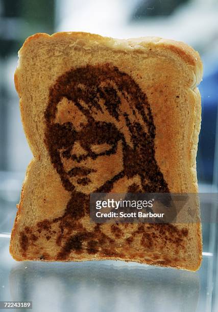 Piece of toast with a portrait of Victoria Beckham sits on display during the Marmart exhibition at the Air Gallery on October 23, 2006 in London,...