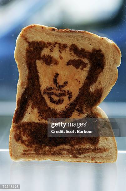 Piece of toast with a portrait of musician James Blunt sits on display during the Marmart exhibition at the Air Gallery on October 23, 2006 in...