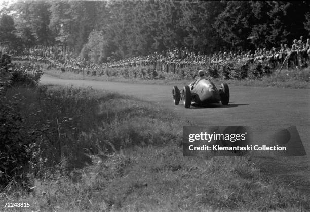 Alberto Ascari on the Hatzenbach section below the North Curve at the Nurburgring, Germany, during the Formula 2 Grand Prix, 20th August 1950.